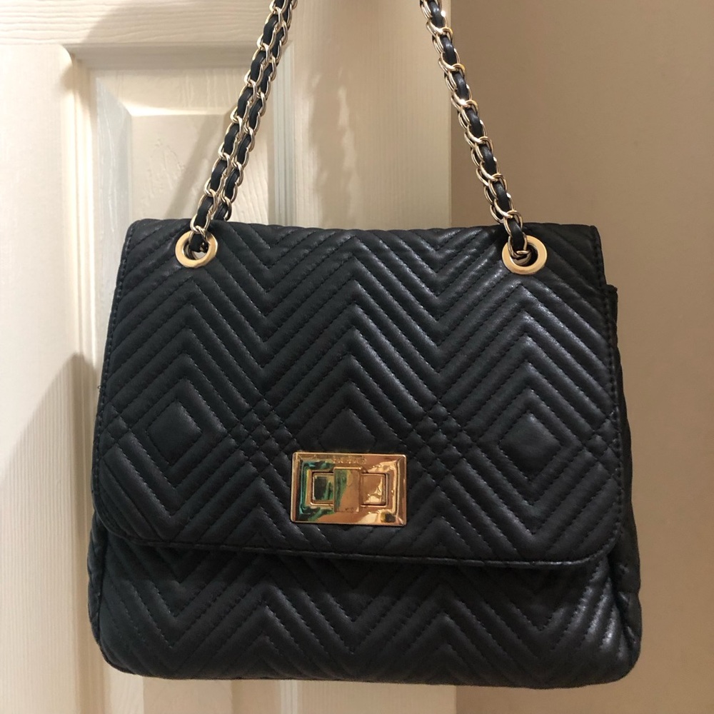 Bebe black handbag shoulder 11 inches length, 4 inch wide, 9 1/2 inches height